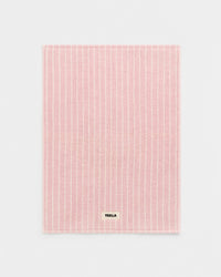 Pink textured mat with 'Tekla' branding on a light gray background