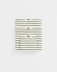 Three striped towels with 'Tekla' branding on a white background