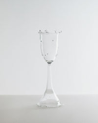 Clear glass goblet on a white background