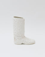 White textured boot on a light gray background