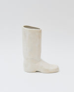 White boot on a light gray background