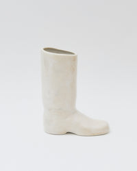 White boot on a light gray background