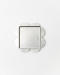 Decorative tray with clover-shaped edges on a white background