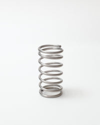 Metallic spring on a white background