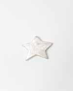 Star-shaped silver ceramic on a white background