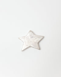 Star-shaped silver ceramic on a white background