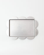 Decorative tray with clover-shaped edges on a white background