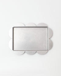 Decorative tray with clover-shaped edges on a white background
