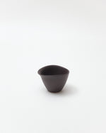 Brown ceramic cup on a white background