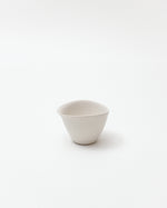 White ceramic cup on a white background
