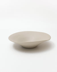 Beige ceramic bowl on a white background