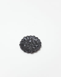 Decorative black plate on a white background