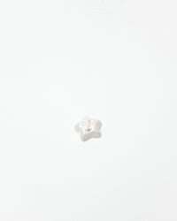 White star-shaped object on a white background