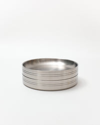 Stack of metal plates on a white background