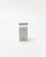 White product packaging with text on a white background