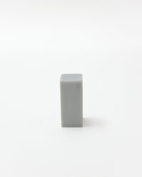 Rectangular blue bar of soap on a white background