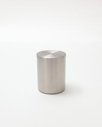 Silver cylindrical container on a white background