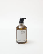 Bottle of liquid soap with pump on a white background