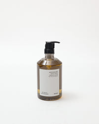 Bottle of liquid soap with pump on a white background