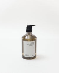 Hand soap bottle with pump on a white background