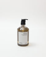 Bottle of hand soap with pump on a white background