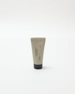 Tube of cream with a black base on a white background