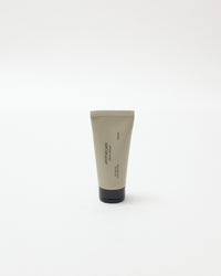 Tube of cream with a black base on a white background