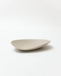 Beige ceramic bowl on a white background