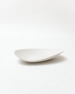 White ceramic plate on a light gray background