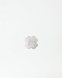 Image with a silver clover form square branded with 'arkisto' logo on a white background