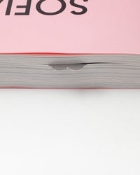 Close-up of a pink book with 'SOFIA' on the cover, showing the pages.