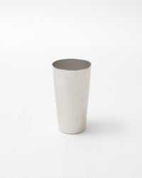 Tin cup on a white background