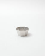 Hexagonal silver bowl on a white background