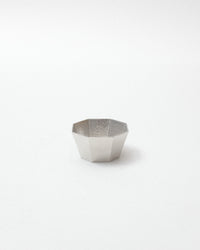 Hexagonal silver bowl on a white background