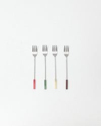 Four forks with colored handles on a white background