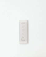 White product packaging with text on a white background