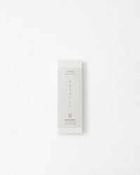 White product packaging with text on a white background