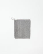 Gray textured face towel on a white background