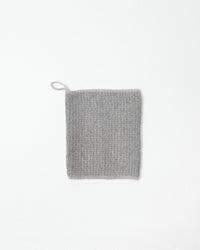 Gray textured face towel on a white background
