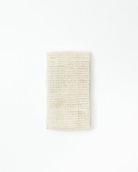Textured white towel on a light gray background