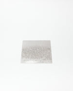 Rectangular white plate with patterns on a white background