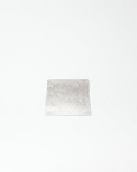 Square tile with a grayish-white pattern on a white background