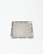 Silver textured square dish on a white background
