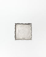 Silver decorative tray on a white background