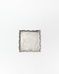 Silver decorative tray on a white background