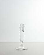 Clear glass flute on a white background