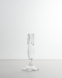 Clear glass flute on a white background