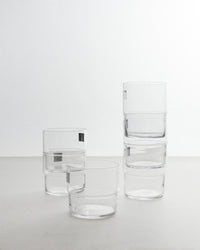 Set of clear glass tumblers on a white background