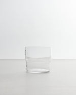 Clear glass tumbler on a white background