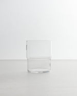 Clear glass tumbler on a white background